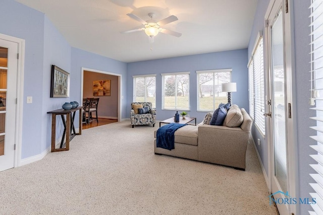 living room featuring ceiling fan