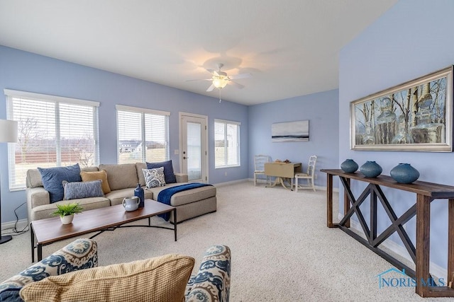 living room featuring light carpet and ceiling fan