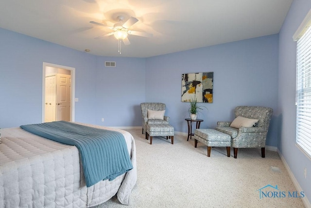 bedroom featuring ceiling fan, carpet, and multiple windows