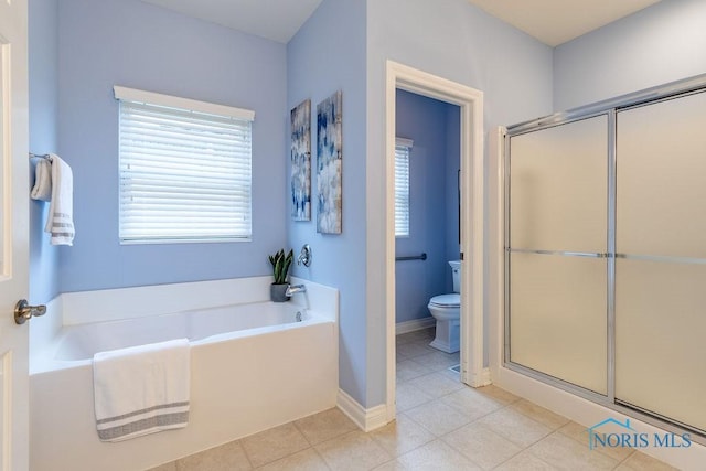 bathroom with plus walk in shower, tile patterned floors, and toilet