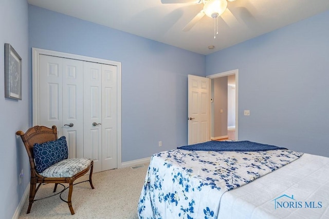 bedroom featuring carpet floors, a closet, and ceiling fan