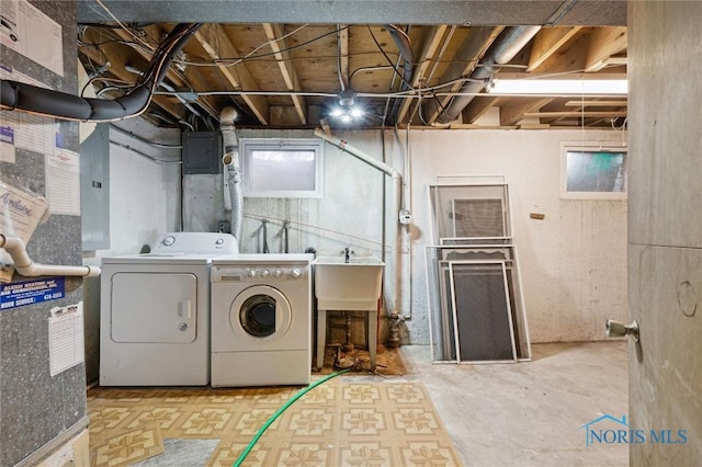 laundry room with washer and clothes dryer and sink