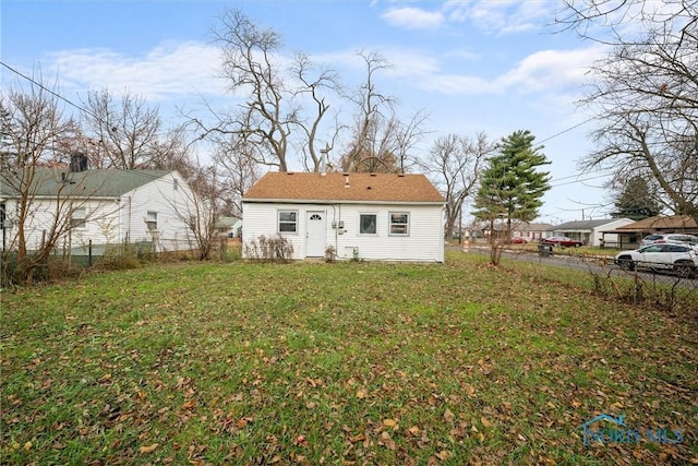 back of house with a yard