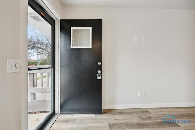 entrance foyer featuring light hardwood / wood-style floors