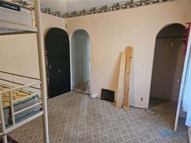 unfurnished bedroom featuring light colored carpet