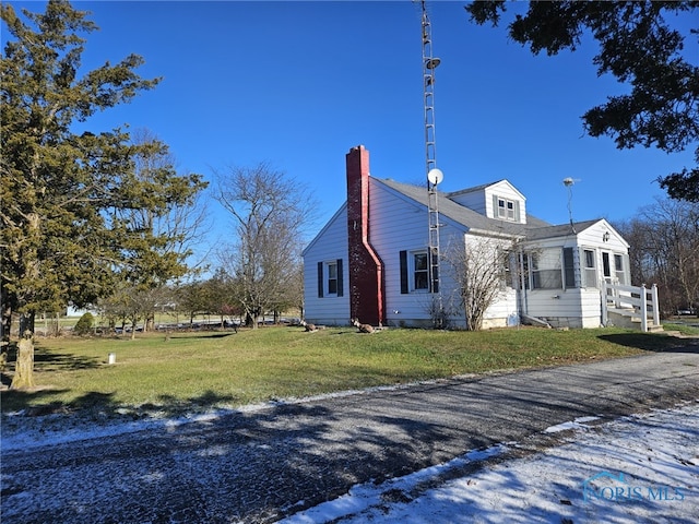 view of property exterior featuring a yard