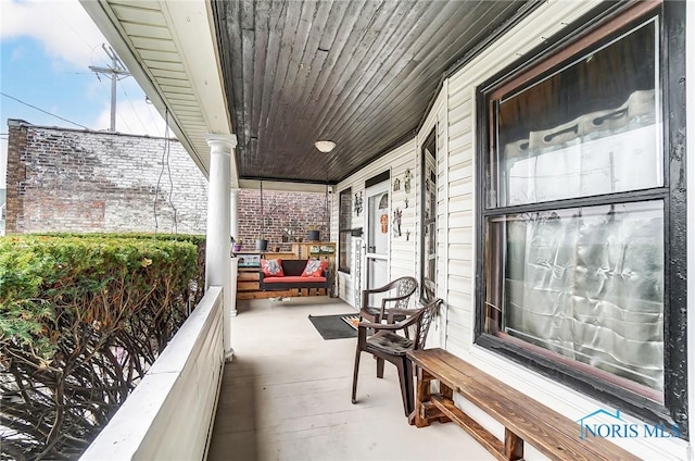 balcony featuring a porch