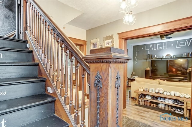 stairway with wood-type flooring