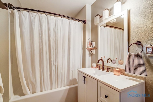 bathroom with shower / bath combination with curtain and vanity