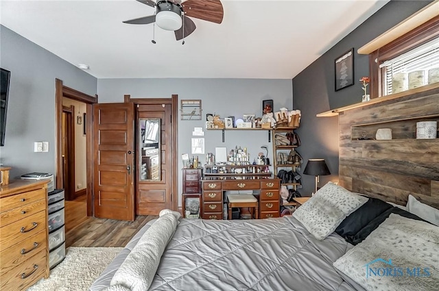 bedroom featuring ceiling fan and light hardwood / wood-style flooring