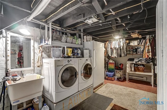 laundry room featuring separate washer and dryer and sink