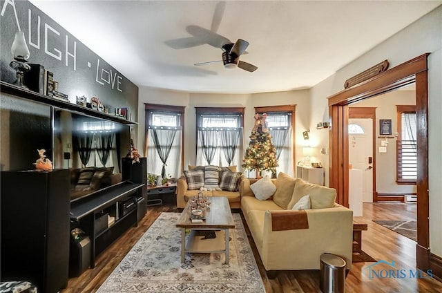 living room featuring hardwood / wood-style flooring, ceiling fan, and a wealth of natural light