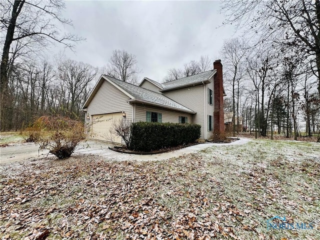 view of side of property featuring a garage