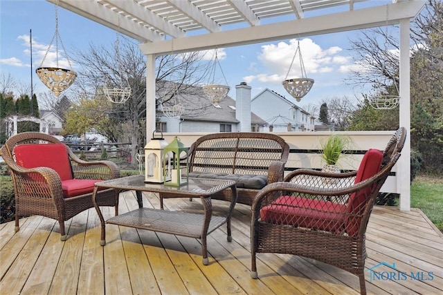 wooden terrace featuring outdoor lounge area and a pergola