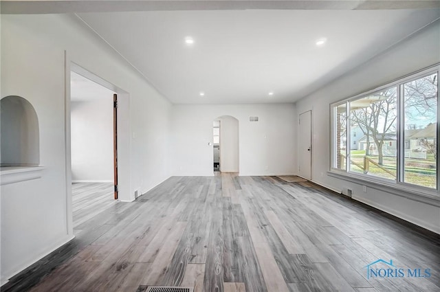 unfurnished living room featuring light hardwood / wood-style flooring