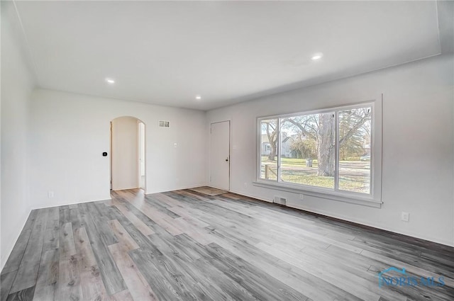 spare room with light hardwood / wood-style floors