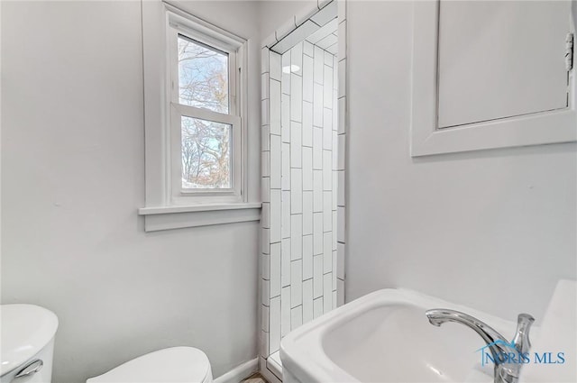 bathroom with toilet and sink