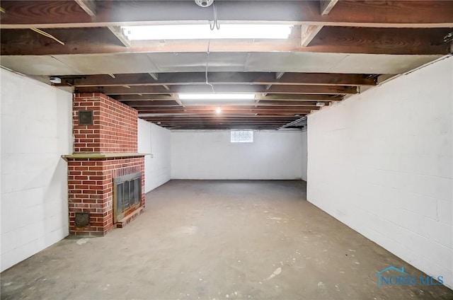 basement with a fireplace