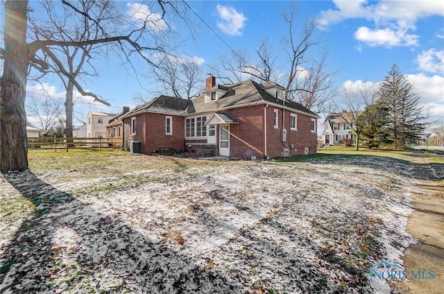 back of house featuring central AC unit