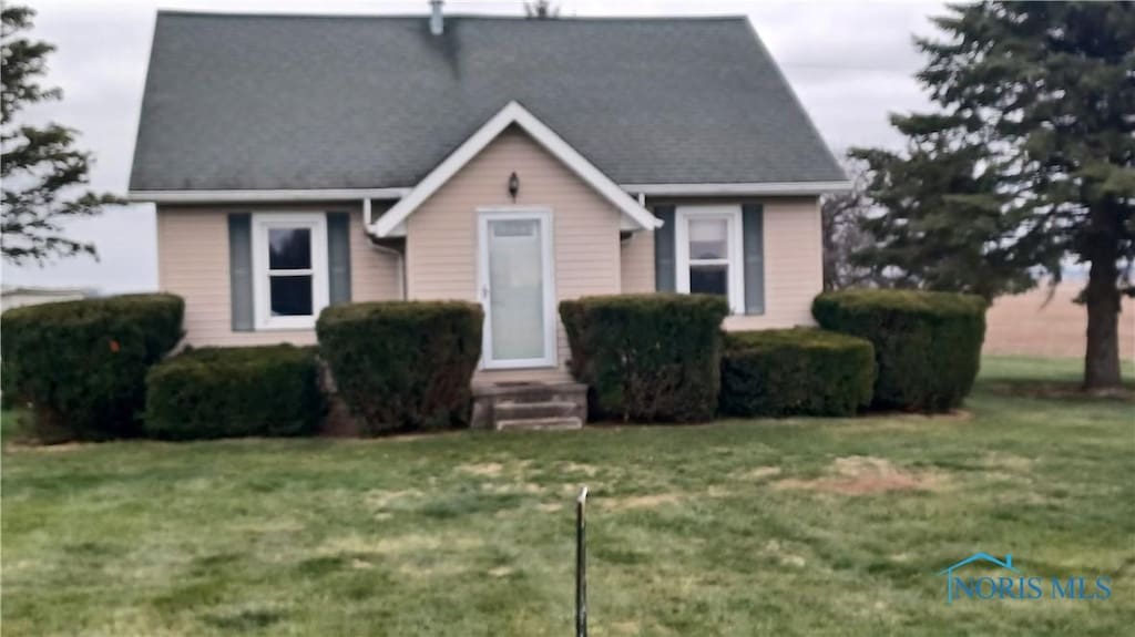 view of front of home with a front yard