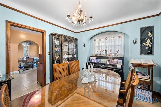 dining room with a notable chandelier and ornamental molding