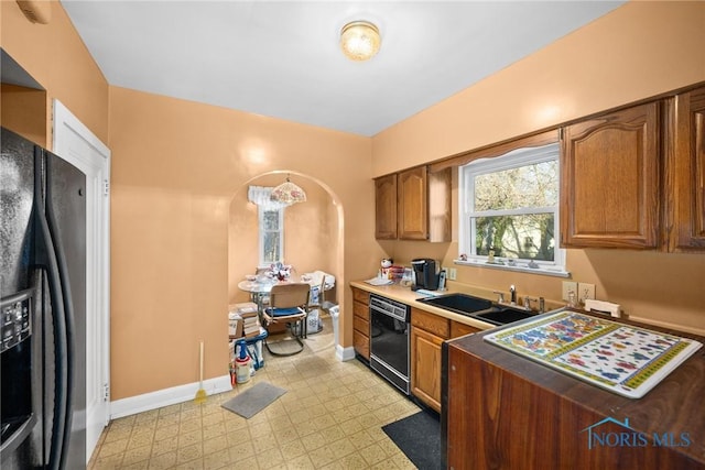 kitchen featuring black appliances and sink