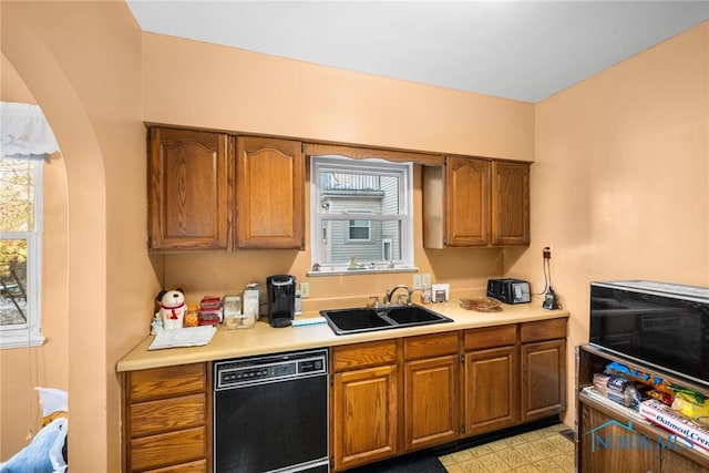 kitchen featuring sink and black dishwasher