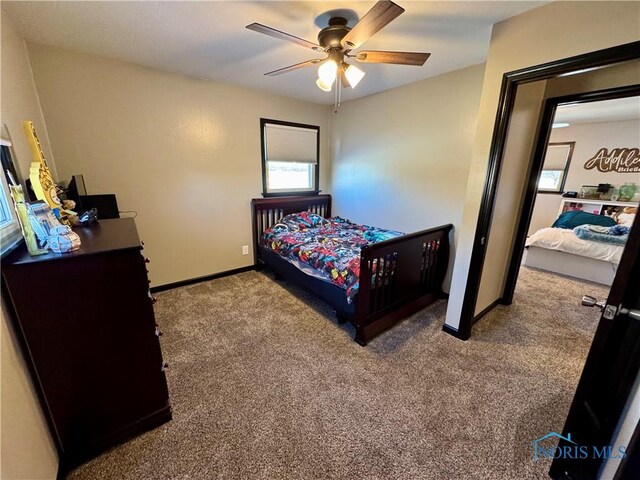 carpeted bedroom with ceiling fan