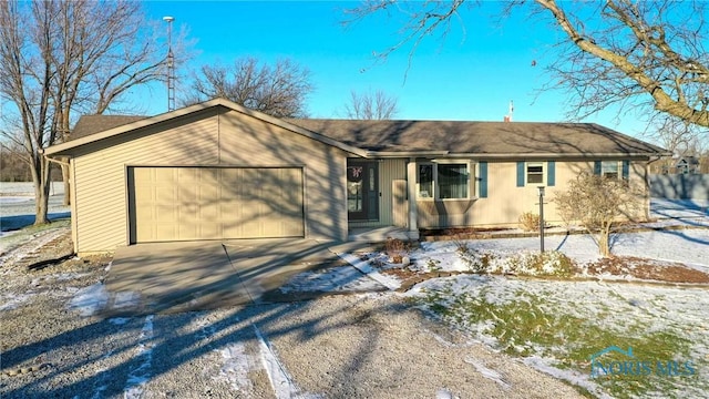 single story home featuring a garage