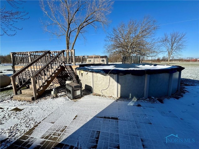 exterior space featuring a swimming pool side deck