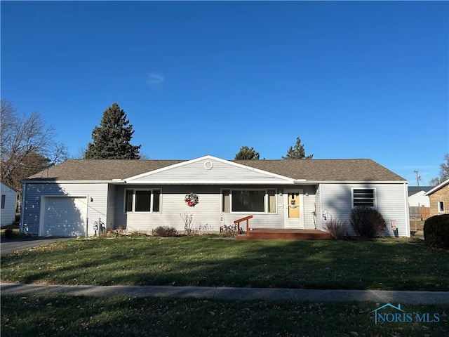 single story home featuring a front yard and a garage