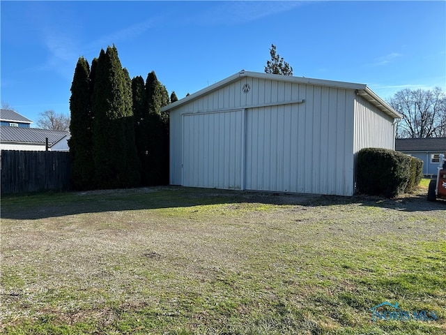 view of outdoor structure with a lawn