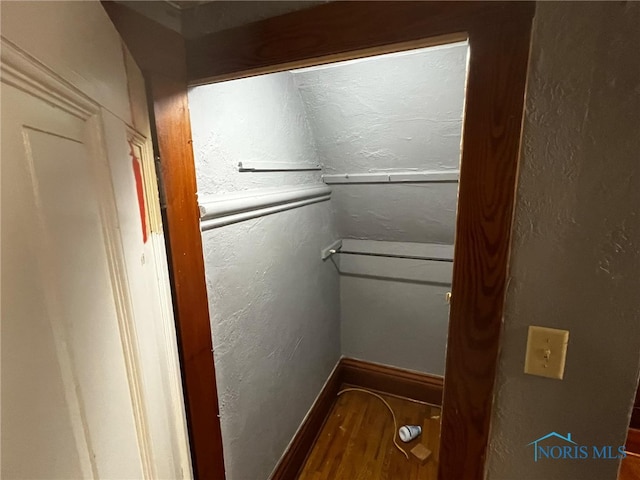 bathroom with hardwood / wood-style flooring