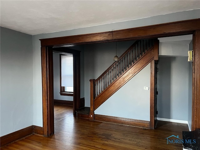 stairs with hardwood / wood-style flooring