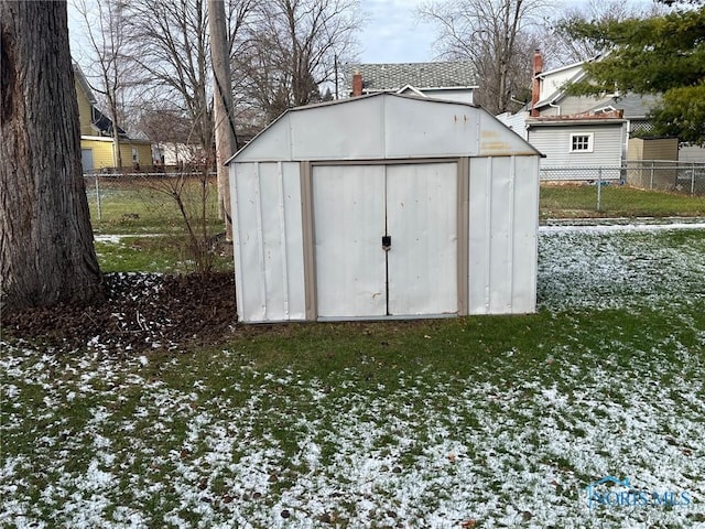 view of outbuilding featuring a yard