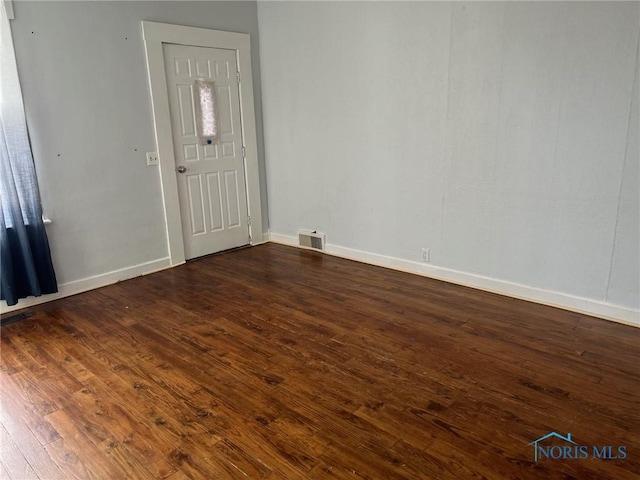 foyer with dark hardwood / wood-style flooring