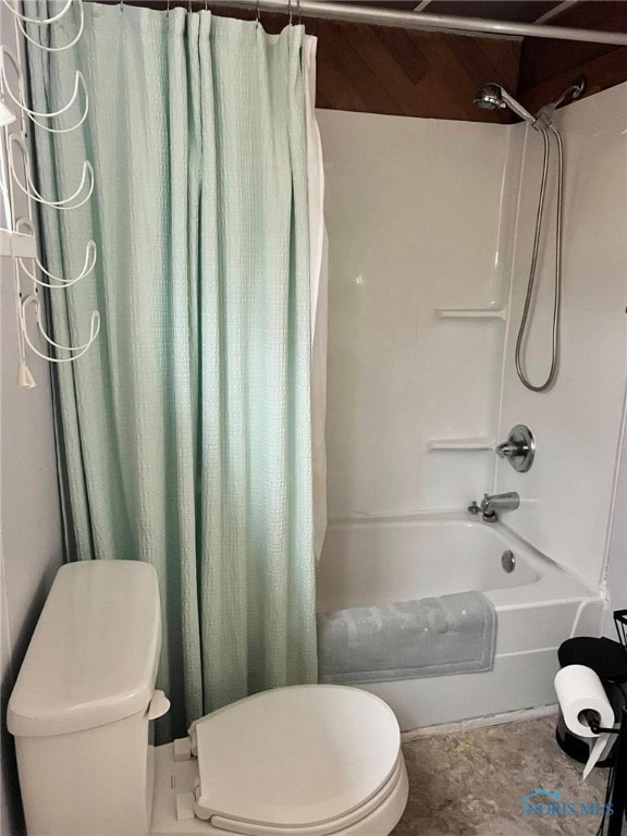 bathroom featuring shower / bath combo and toilet