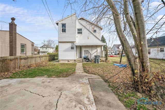 back of house with a patio