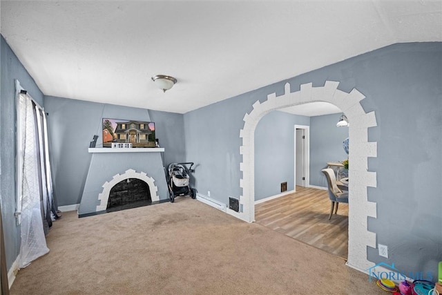 carpeted living room with vaulted ceiling