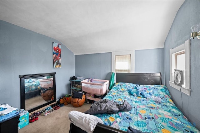 bedroom featuring carpet, vaulted ceiling, and multiple windows