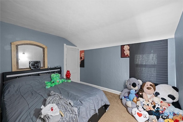 carpeted bedroom featuring lofted ceiling