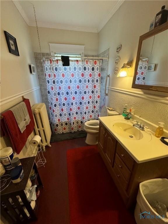 bathroom featuring a shower with curtain, crown molding, vanity, and toilet