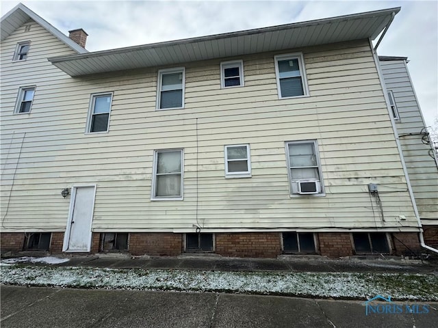 back of property featuring cooling unit