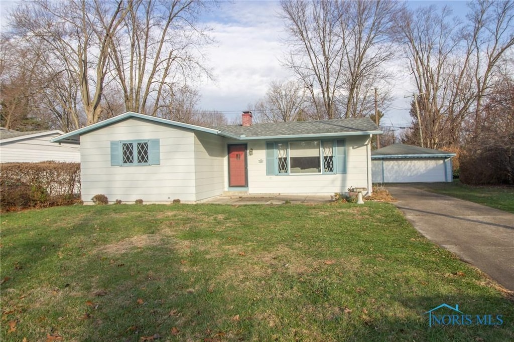 ranch-style home with a front yard and a garage