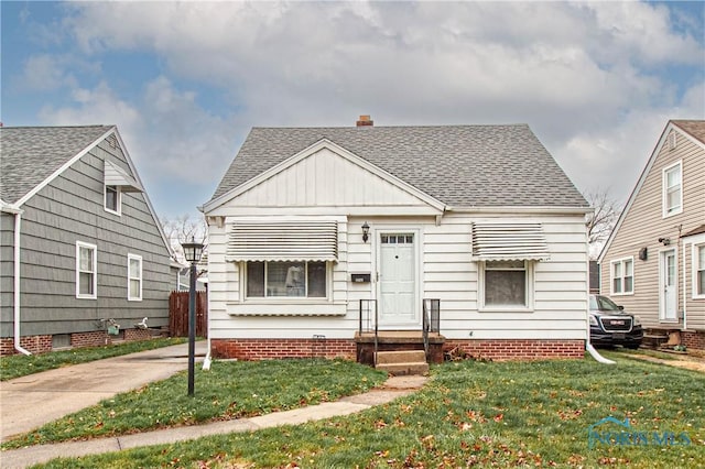 bungalow with a front yard