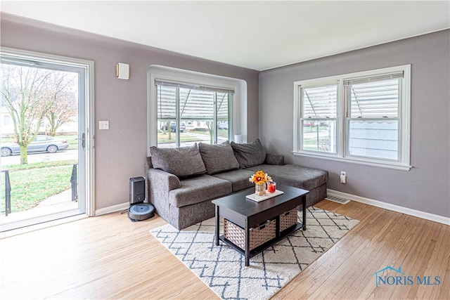 living room with light hardwood / wood-style floors