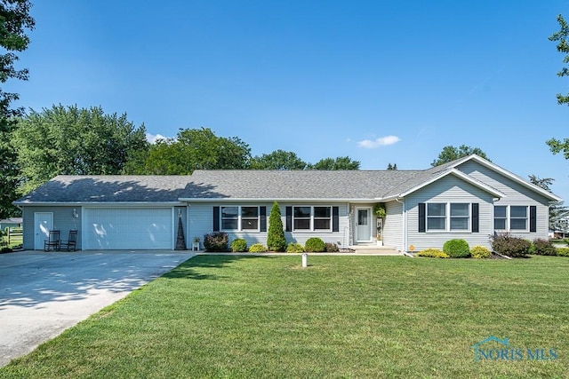 ranch-style home with a garage and a front lawn