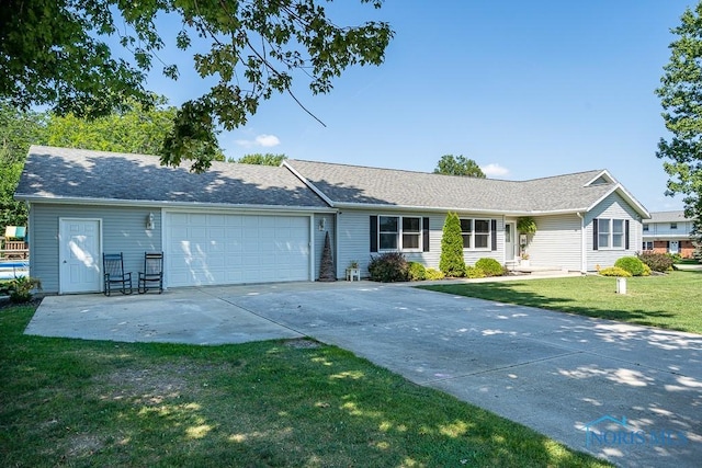 single story home with a garage and a front yard