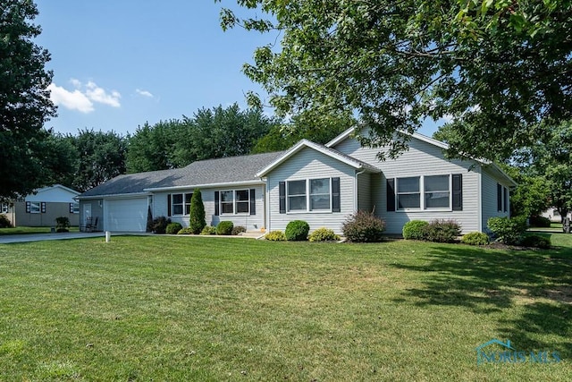 single story home with a front yard and a garage