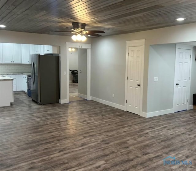 interior space featuring ceiling fan, dark hardwood / wood-style floors, and wooden ceiling